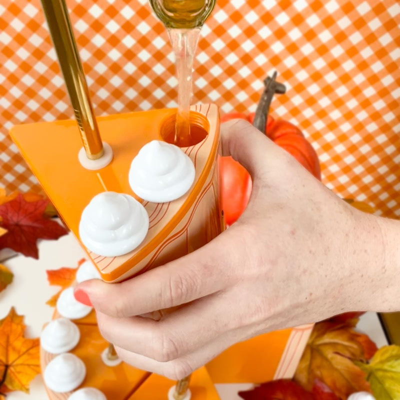 filling up pumpkin pie sipper with whipped topping open